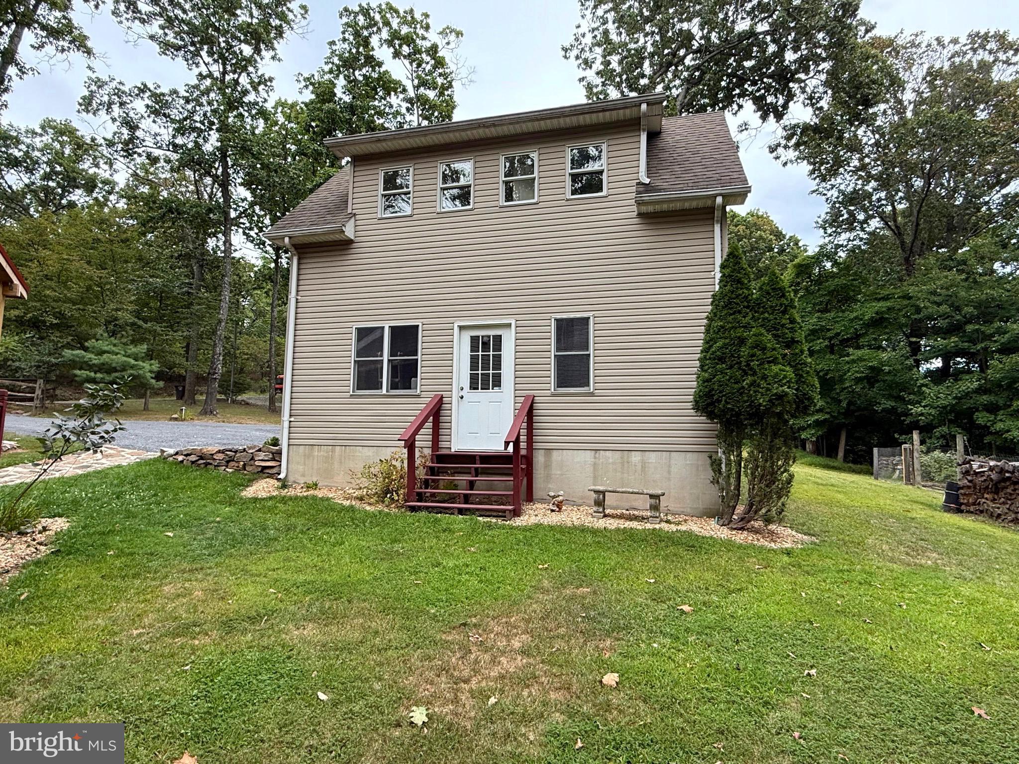 348 Trapper Ridge Lane Hedgesville, WV 25427 - Photo 27 of 41 a view of a house with backyard