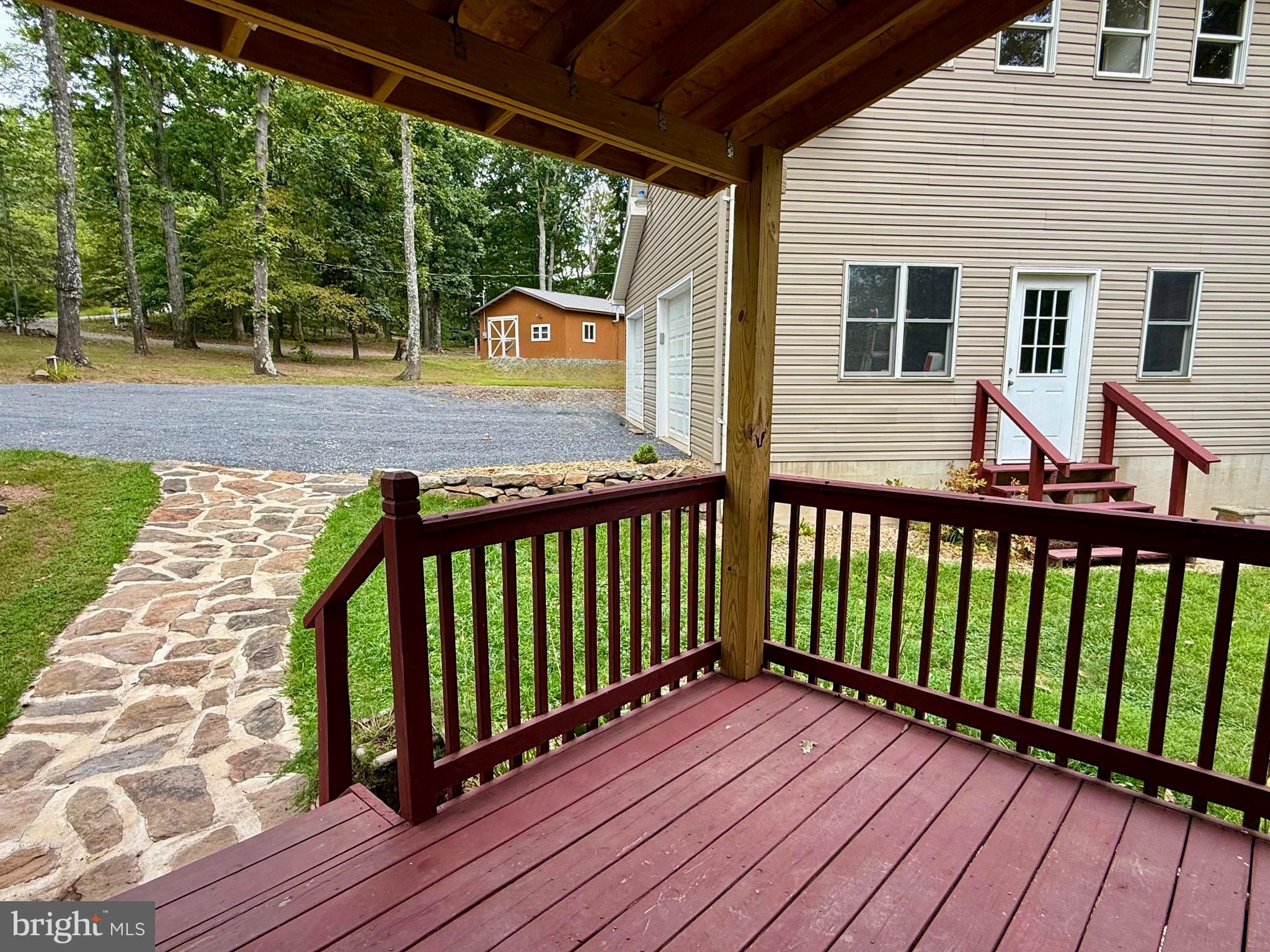 348 Trapper Ridge Lane Hedgesville, WV 25427 - Photo 29 of 41 a view of a wooden deck with a yard