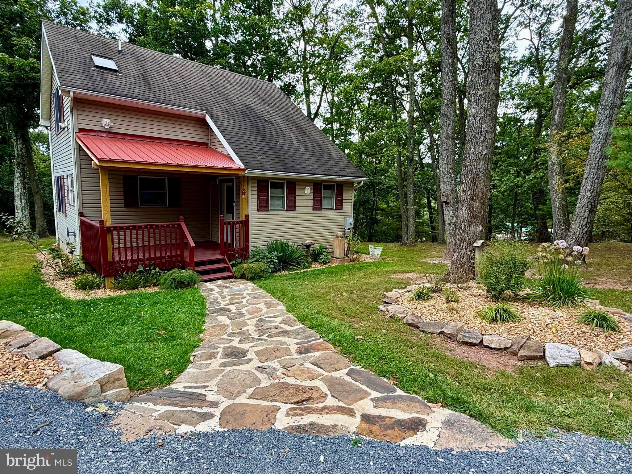 348 Trapper Ridge Lane Hedgesville, WV 25427 - Photo 3 of 41 a front view of a house with a yard