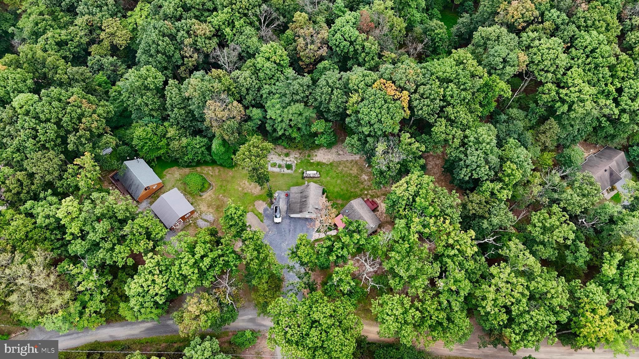348 Trapper Ridge Lane Hedgesville, WV 25427 - Photo 31 of 41 an aerial view of a house with a yard and outdoor seating