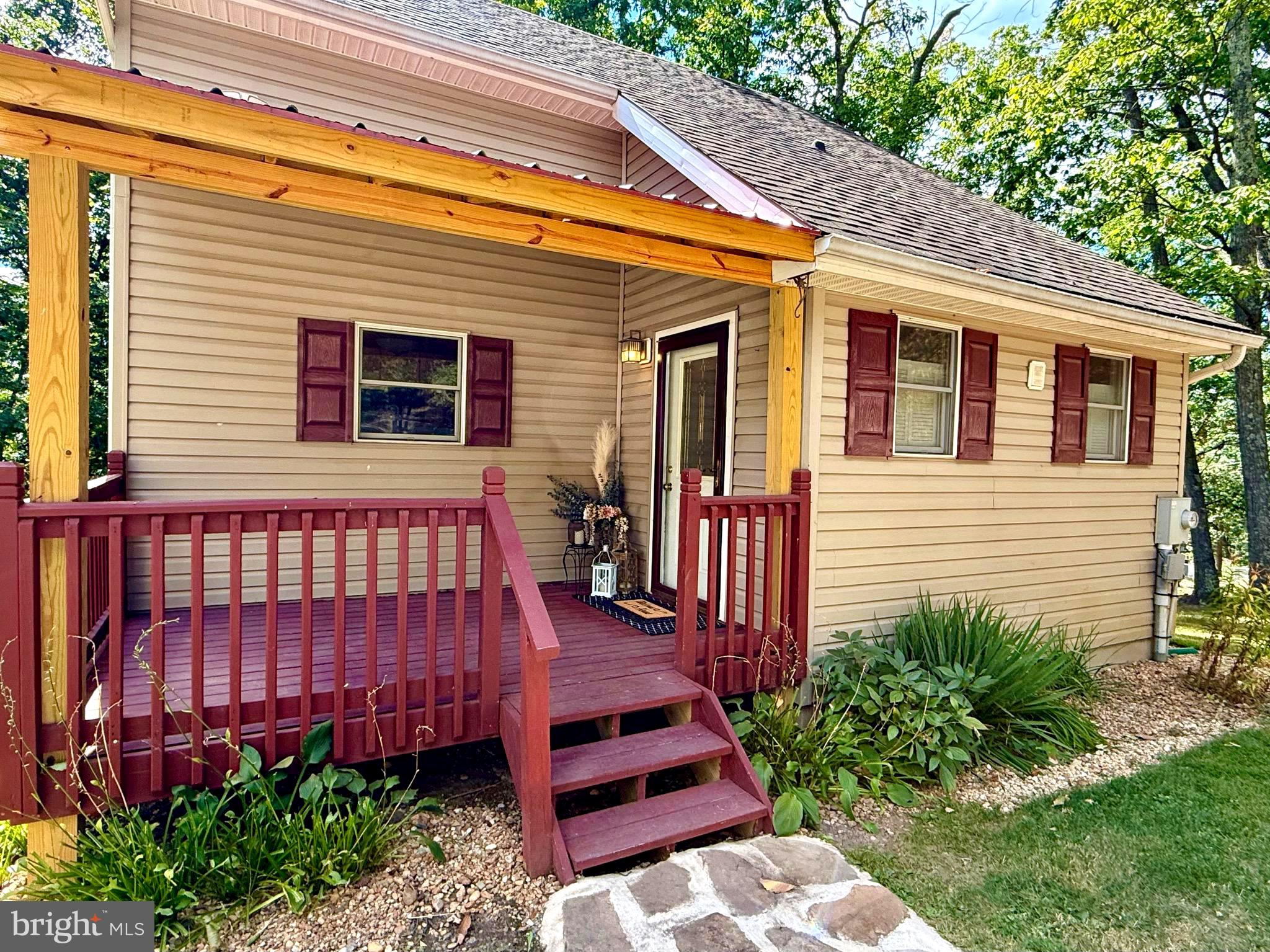 348 Trapper Ridge Lane Hedgesville, WV 25427 - Photo 40 of 41 a backyard of a house with lots of green space