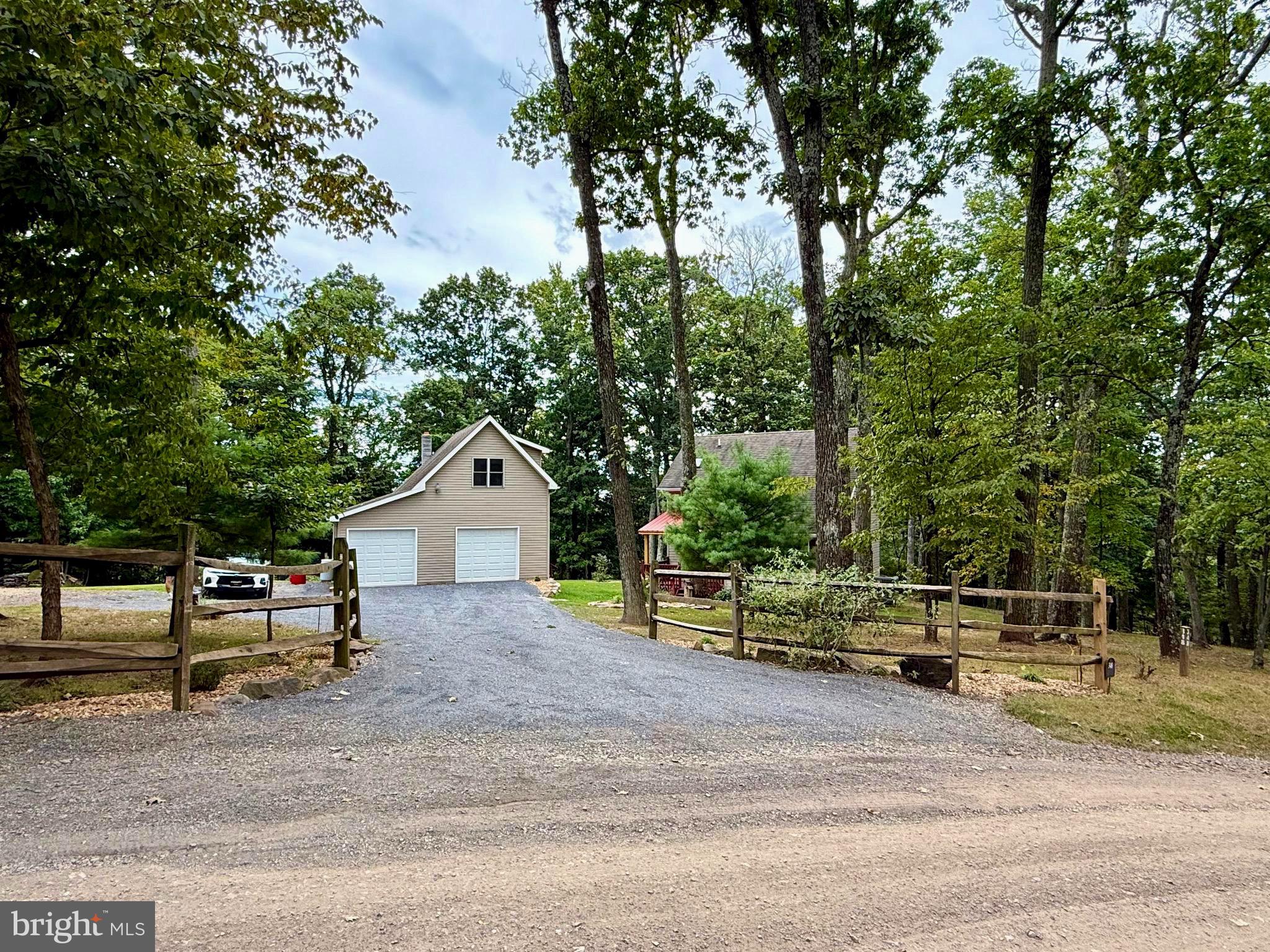 348 Trapper Ridge Lane Hedgesville, WV 25427 - Photo 4 of 41 a view of backyard with a garden and entertaining space