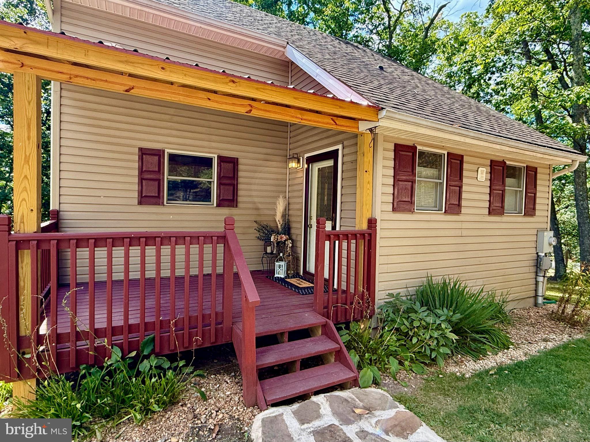 348 Trapper Ridge Lane Hedgesville, WV 25427 - Photo 5 of 41 a backyard of a house with lots of green space