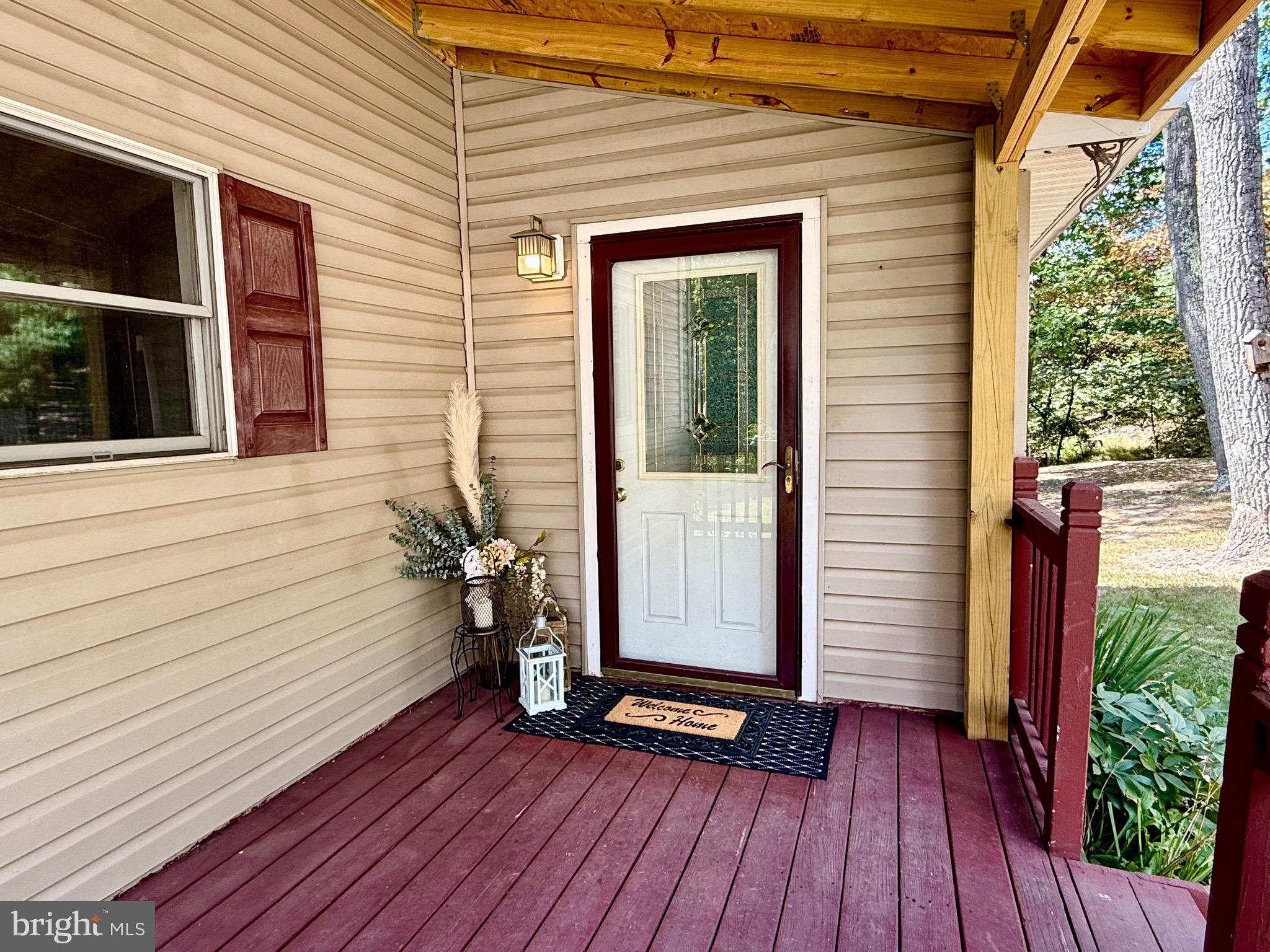 348 Trapper Ridge Lane Hedgesville, WV 25427 - Photo 6 of 41 a view of front door deck and hardwood floor