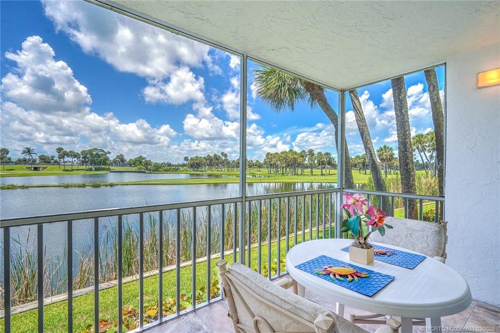 5593 Northeast Gulfstream Way Jensen Beach, FL 34957 - Photo 18 of 39 a view of a balcony with lake view and a potted plant