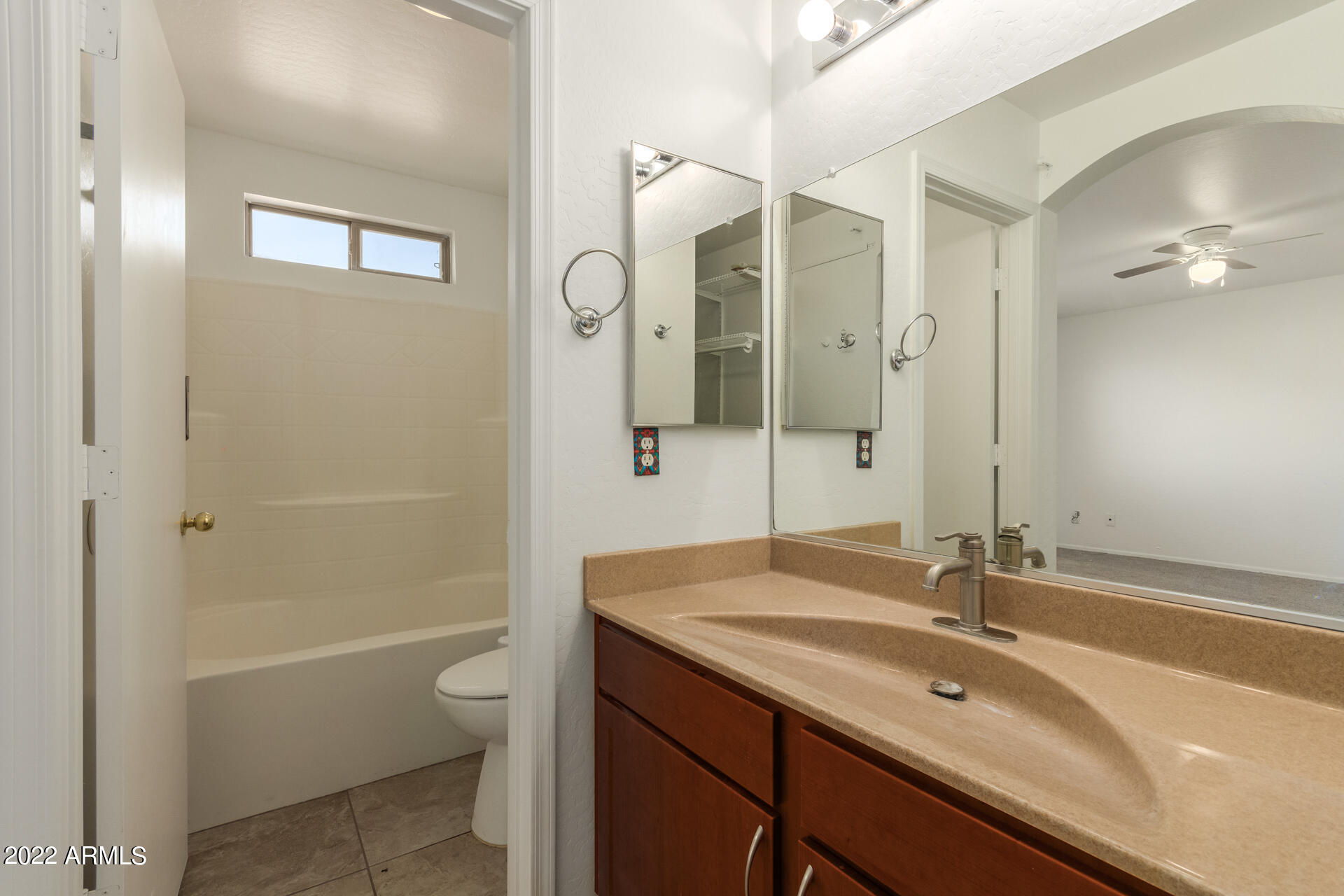 23740 West Grove Street Buckeye, AZ 85326 - Photo 13 of 23 a bathroom with a sink a toilet and shower