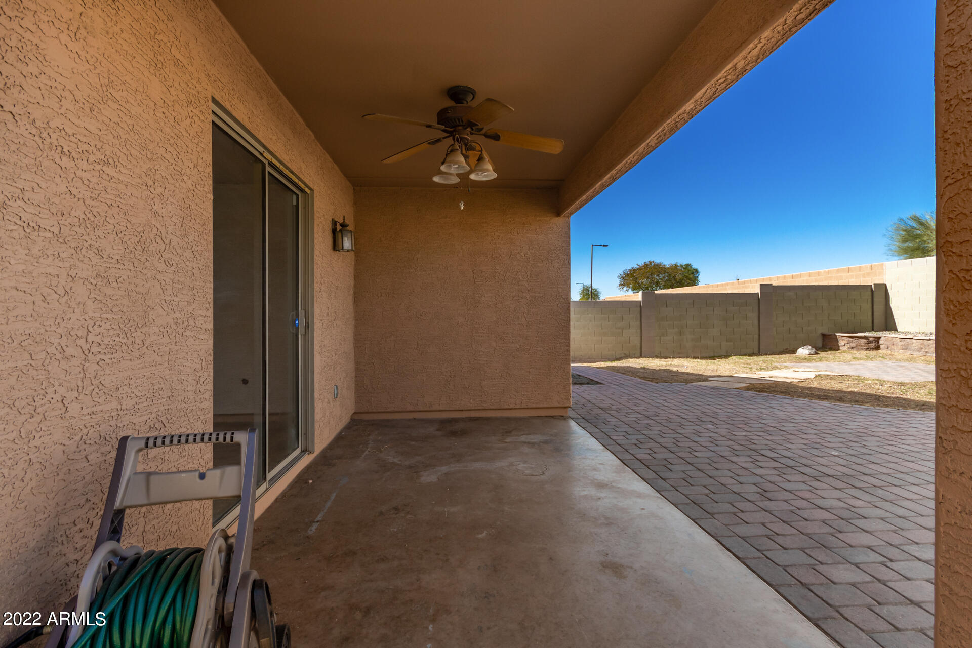 23740 West Grove Street Buckeye, AZ 85326 - Photo 19 of 23 a view of a living room with a sink and chandelier