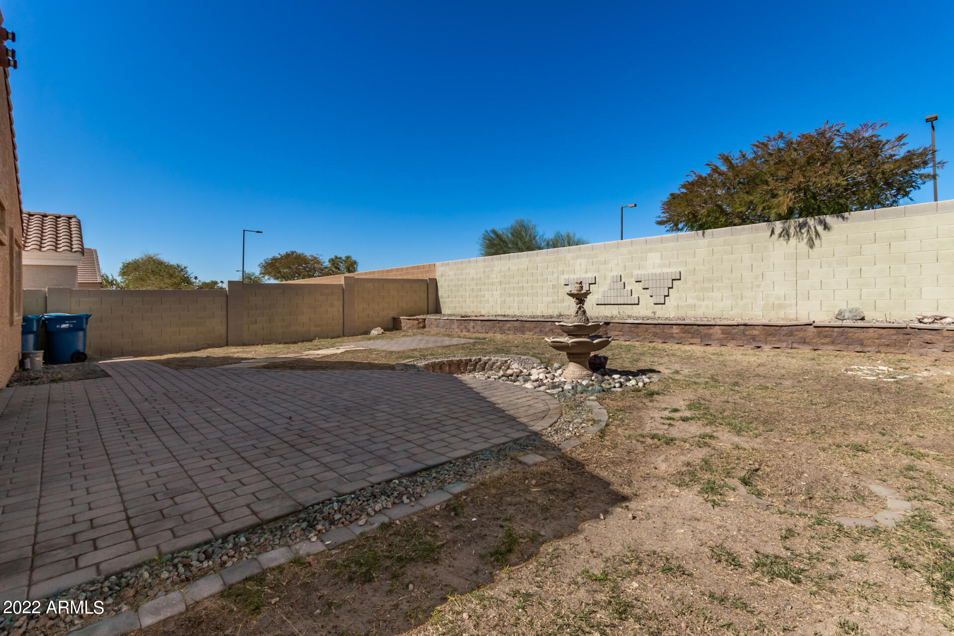 23740 West Grove Street Buckeye, AZ 85326 - Photo 20 of 23 a view of a dry yard with wooden fence
