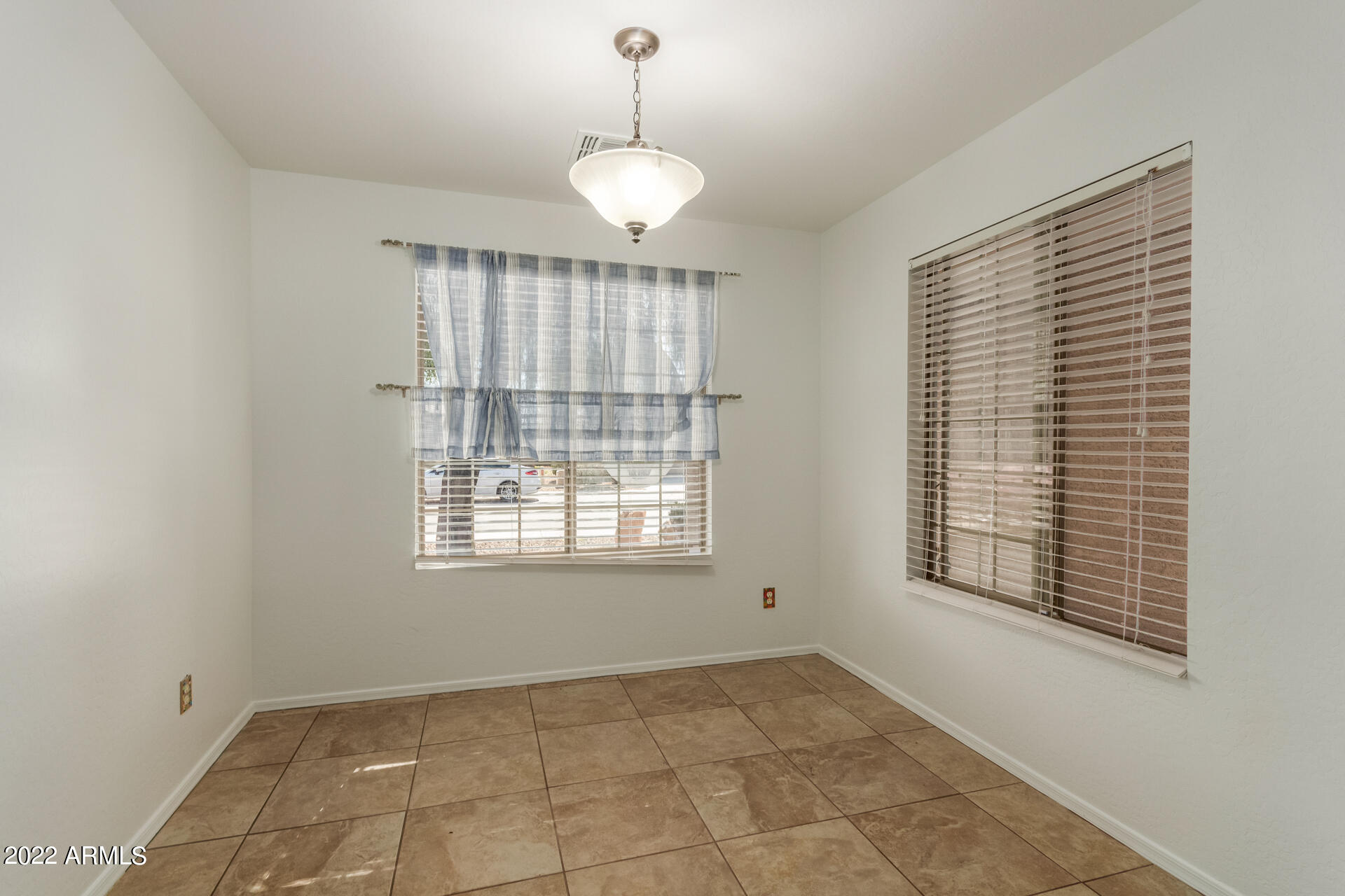 23740 West Grove Street Buckeye, AZ 85326 - Photo 10 of 23 a view of an empty room with a window