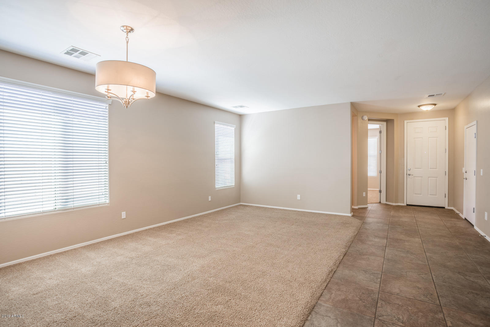 3101 South Joshua Tree Lane Gilbert, AZ 85295 - Photo 14 of 88 a view of an empty room with a window