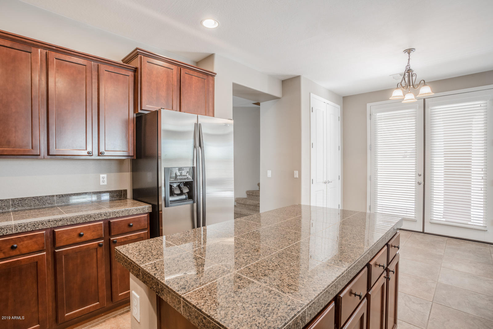 3101 South Joshua Tree Lane Gilbert, AZ 85295 - Photo 21 of 88 a kitchen with stainless steel appliances granite countertop a refrigerator a sink and a stove