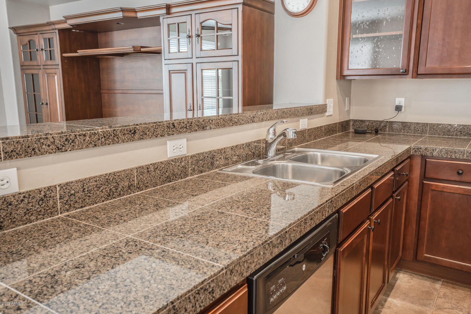 3101 South Joshua Tree Lane Gilbert, AZ 85295 - Photo 26 of 88 a kitchen with granite countertop a sink and a stove
