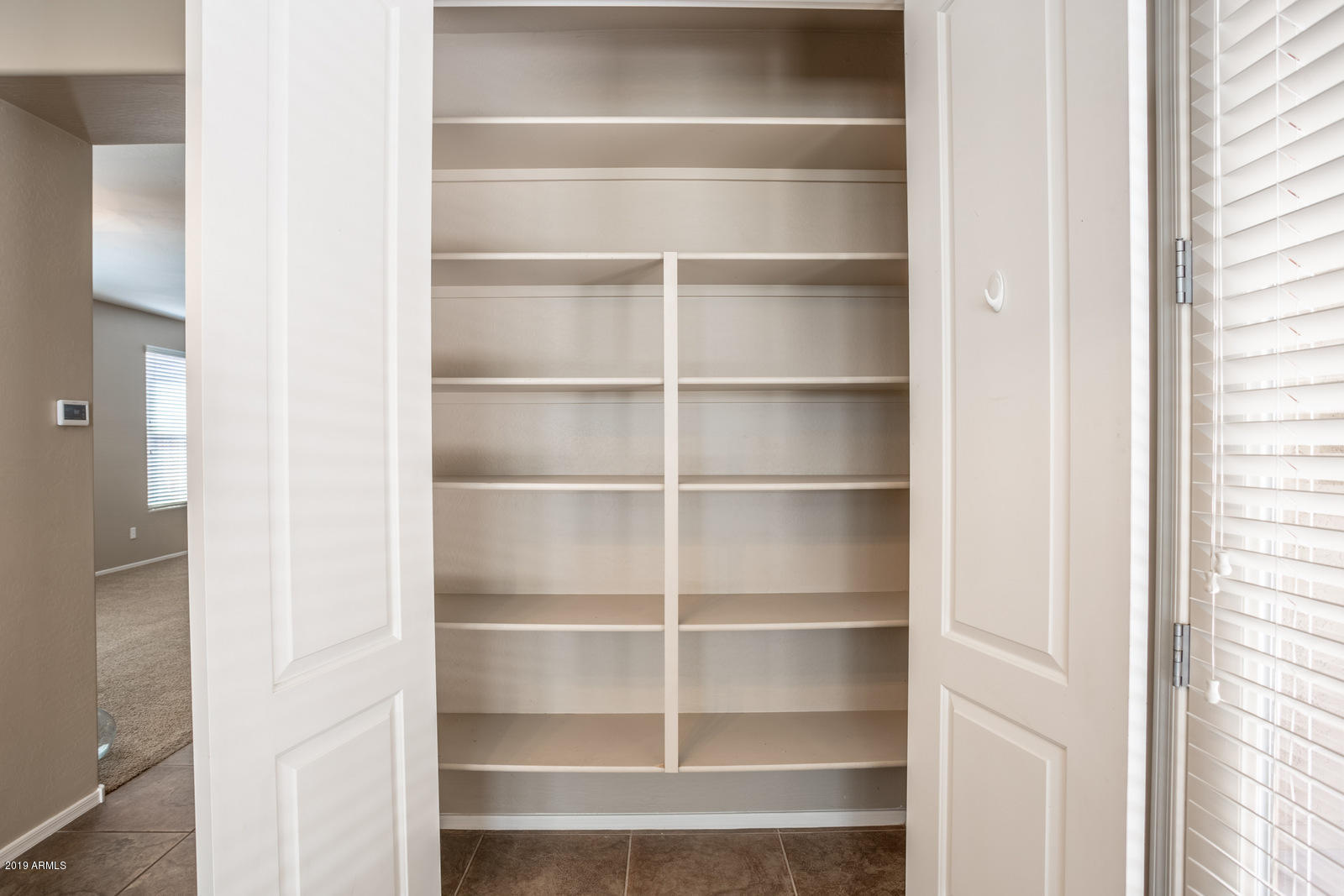 3101 South Joshua Tree Lane Gilbert, AZ 85295 - Photo 27 of 88 a view of walk in closet with empty racks