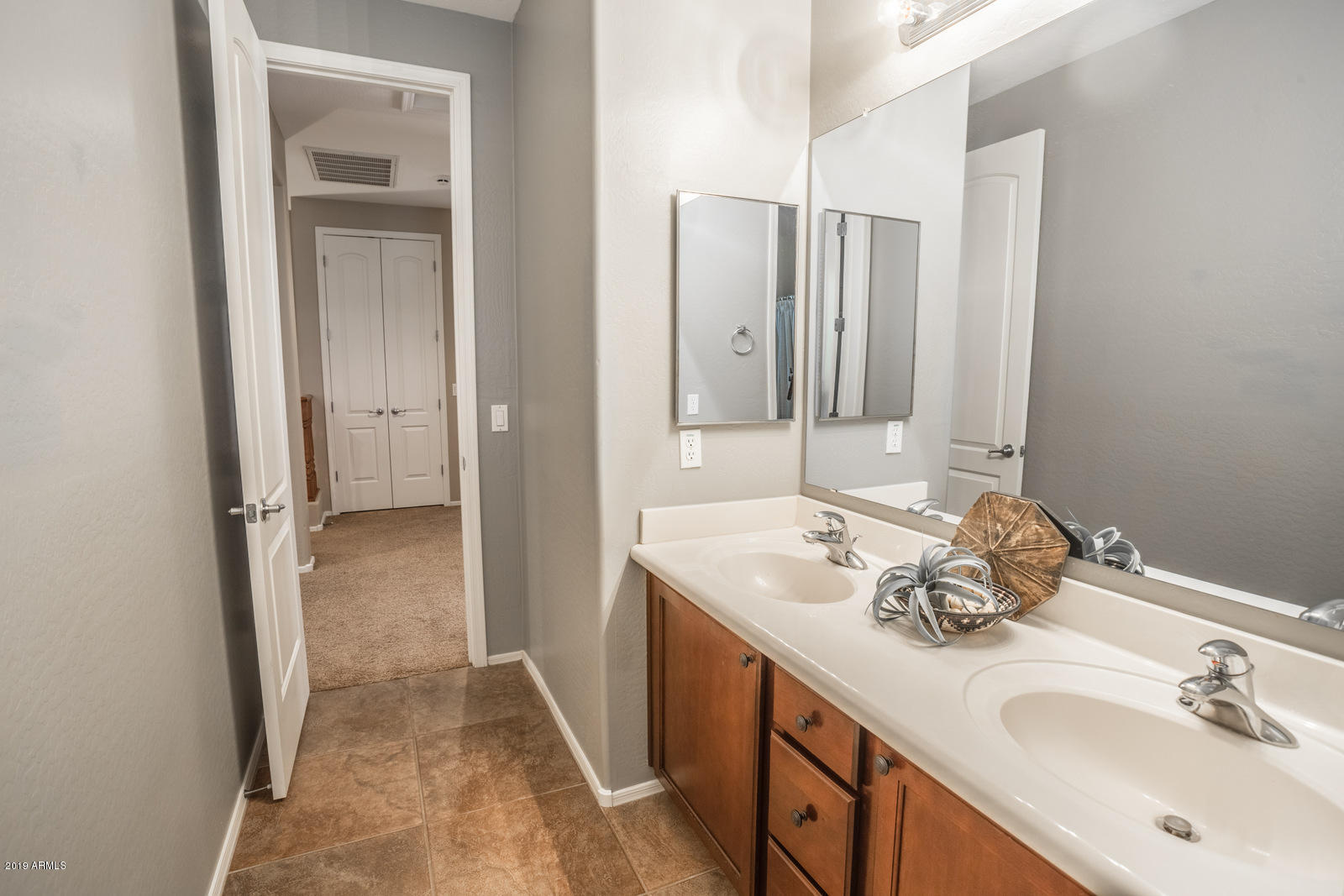 3101 South Joshua Tree Lane Gilbert, AZ 85295 - Photo 43 of 88 a bathroom with a sink and a mirror
