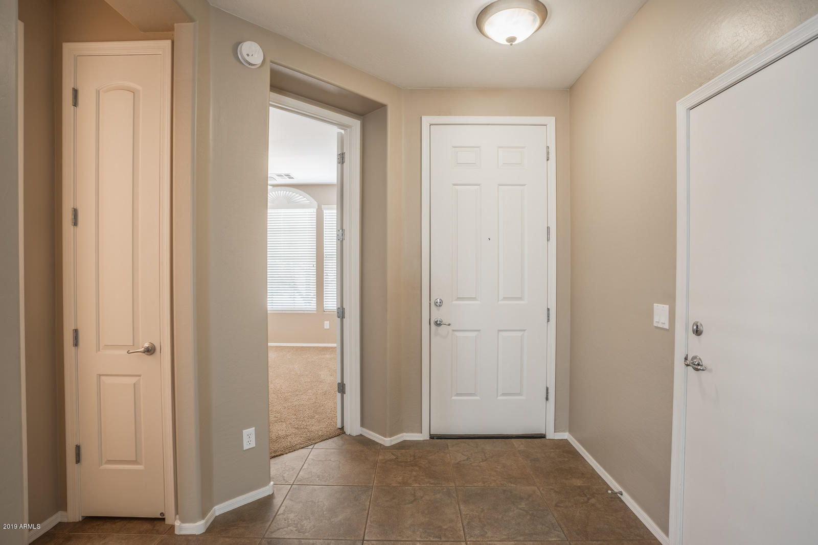 3101 South Joshua Tree Lane Gilbert, AZ 85295 - Photo 6 of 88 a view of an entryway with wooden floor