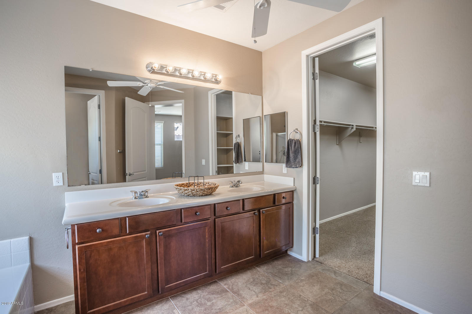 3101 South Joshua Tree Lane Gilbert, AZ 85295 - Photo 66 of 88 a bathroom with a granite countertop sink and a mirror