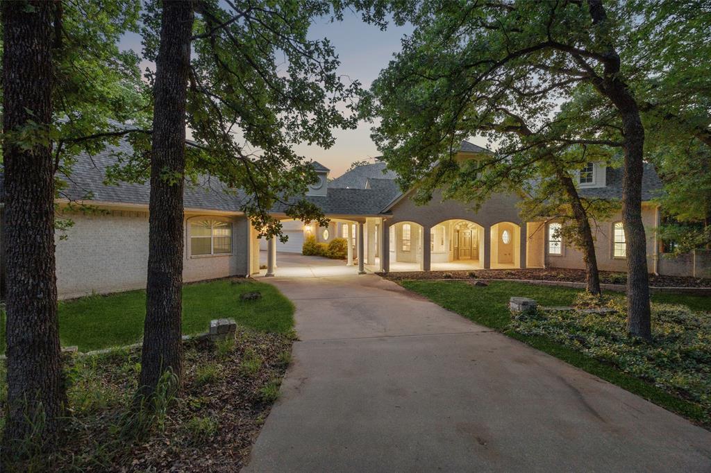 10984 Stagecoach Pass Pilot Point, TX 76258 - Photo 4 of 38 Gated entrance with private treelined drive.