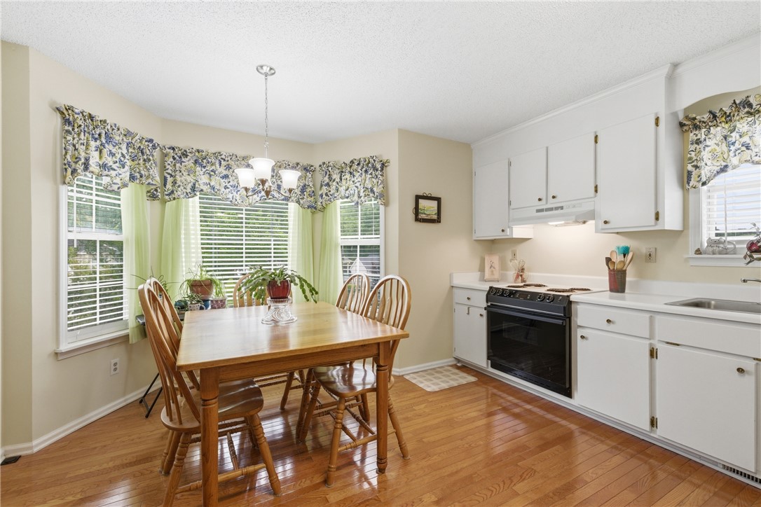 128 Kelly Lane Easley, SC 29642 - Photo 8 of 23 A well-lit kitchen with ample meal space and abundant cabinetry, ready for everyday living.