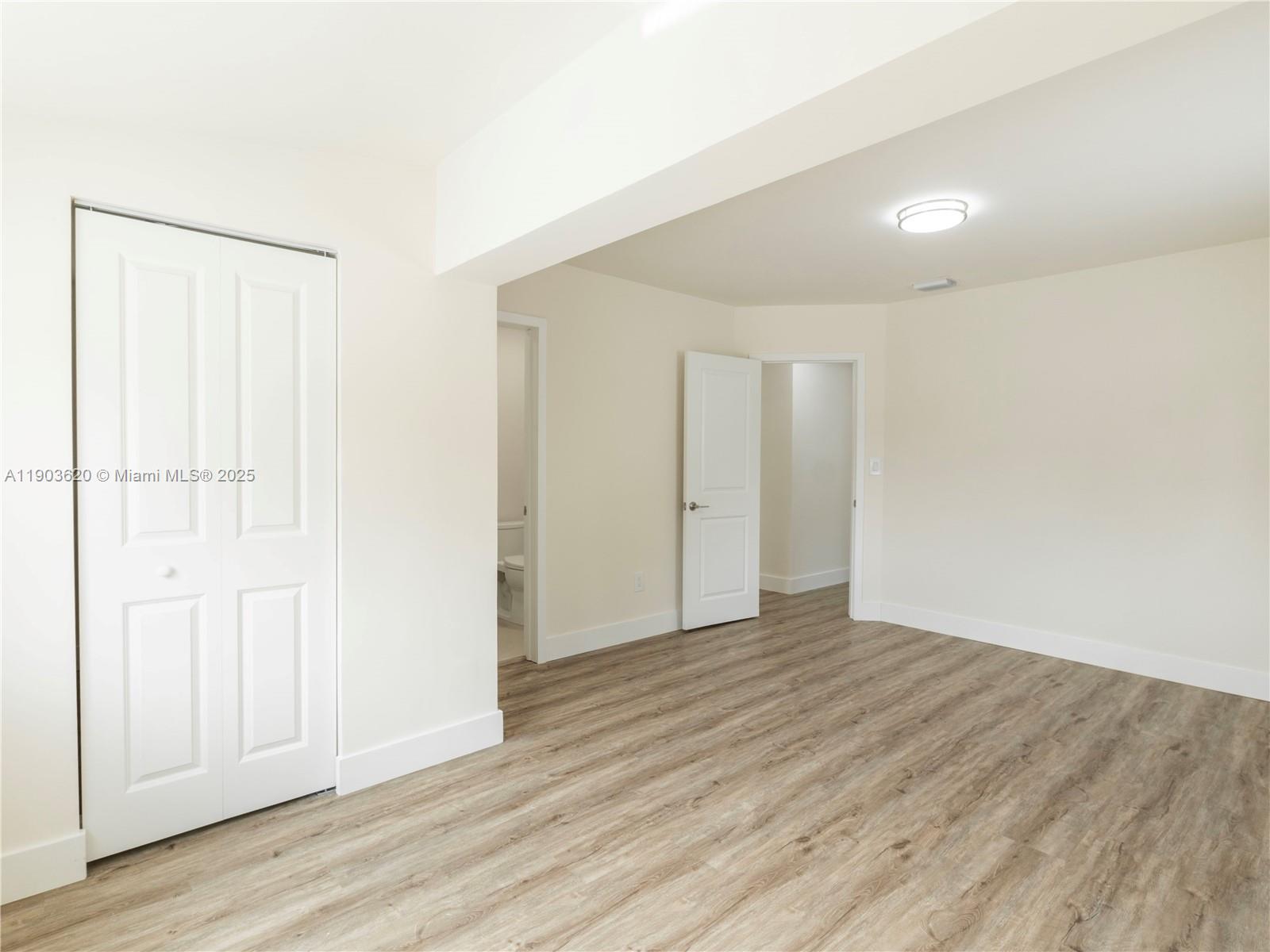 3051 Northwest 70th Terrace Miami, FL 33147 - Photo 31 of 32 a view of an empty room with wooden floor