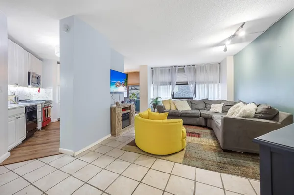 a view of living room with furniture and flat screen tv