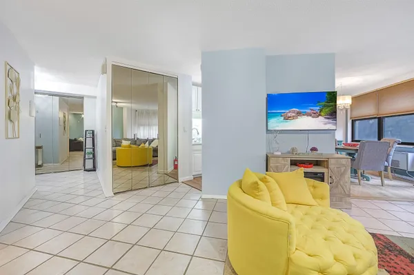 a living room with furniture and a lamp