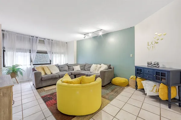 a kitchen with stainless steel appliances a stove a microwave cabinets and a counter space