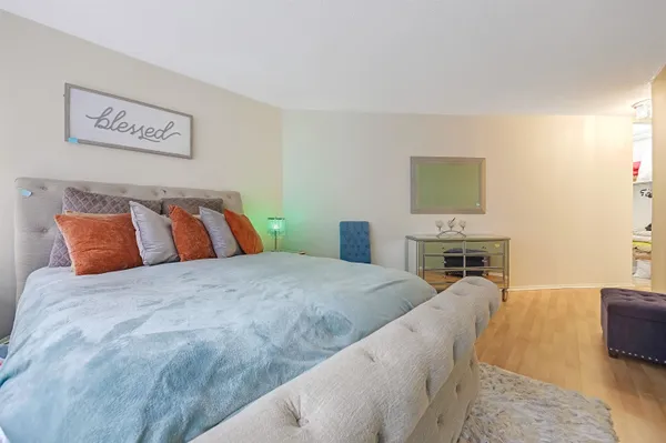 a bedroom with a bed and a couch