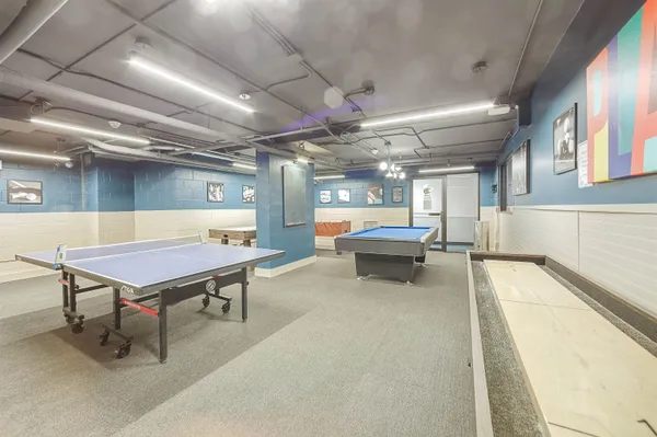 a room with furniture and pool table
