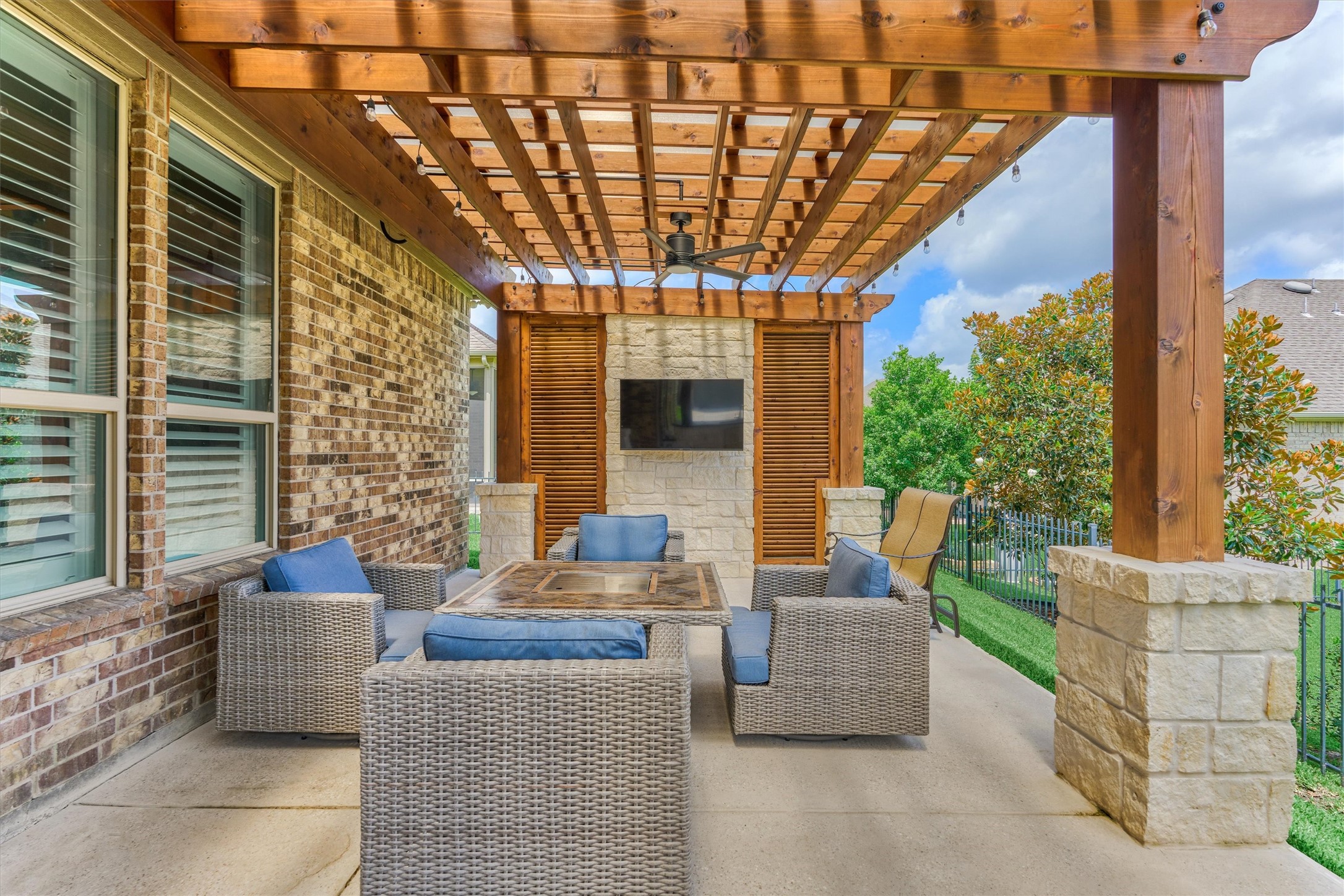 108 Wild Wick Way Spring, TX 77382 - Photo 37 of 44 The Covered Back Pato Extends The Living And Entertaining Space Outside; Note The Solid 8x8 Posts Along With The Stone Skirts. This Structure Has Been Built Rock Solid!