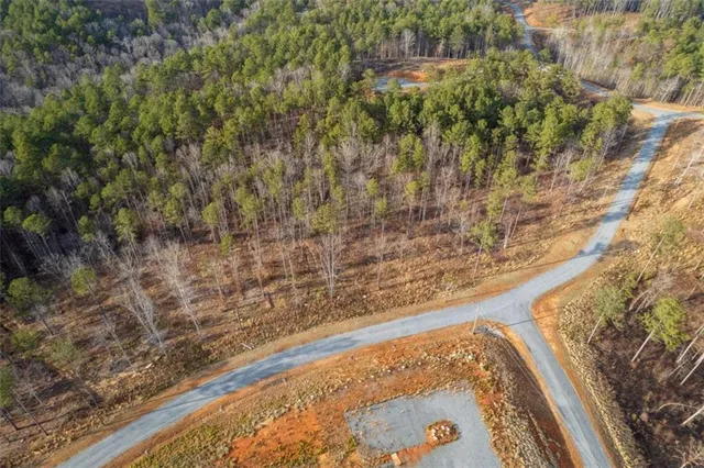 a view of a yard with a wooden wall