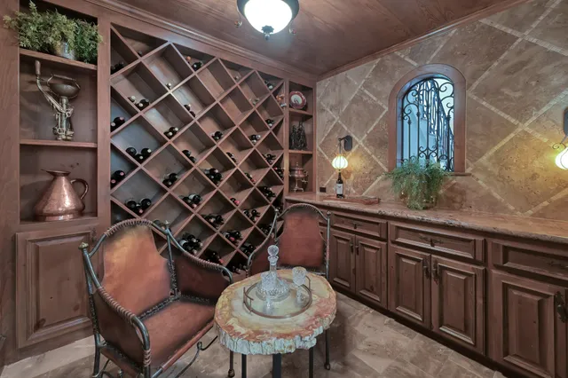 a kitchen with a sink and a chairs