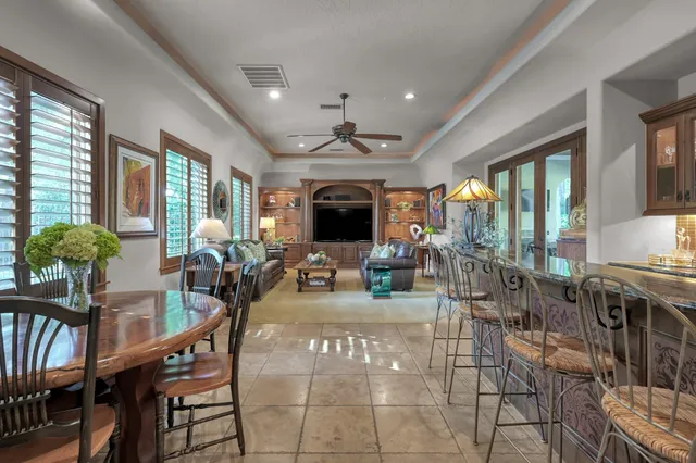 a view of a dining room with furniture window and outside view