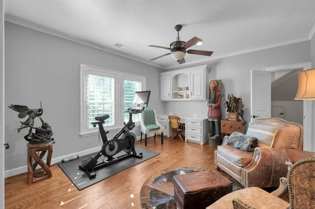 a living room with furniture a air conditioner and a window