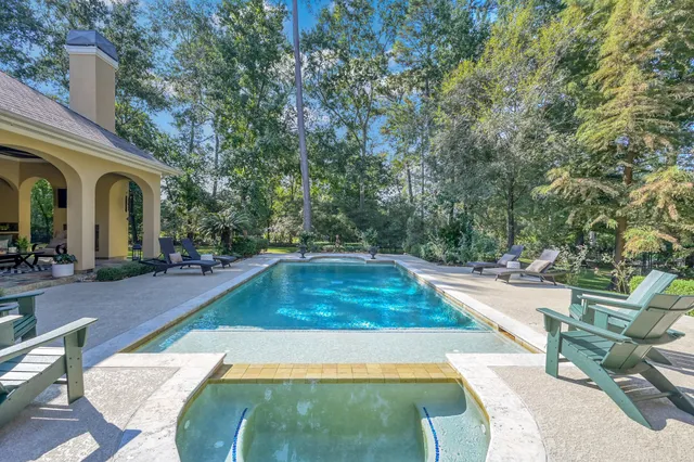 a view of a swimming pool with a patio