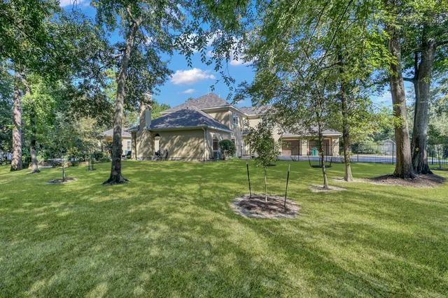 a backyard of a house with lots of green space