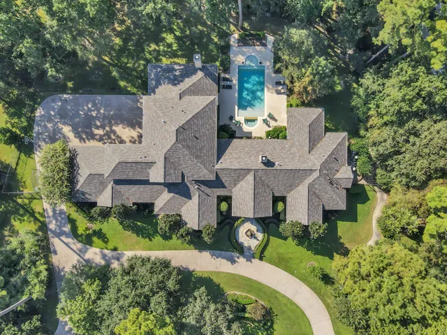 an aerial view of a house with a garden