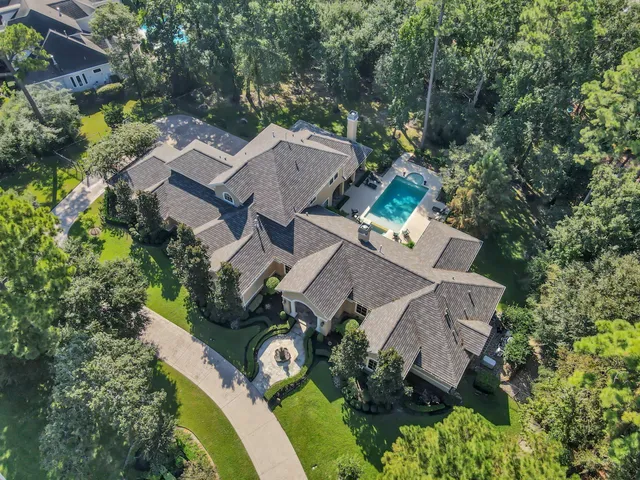 an aerial view of a house with outdoor space