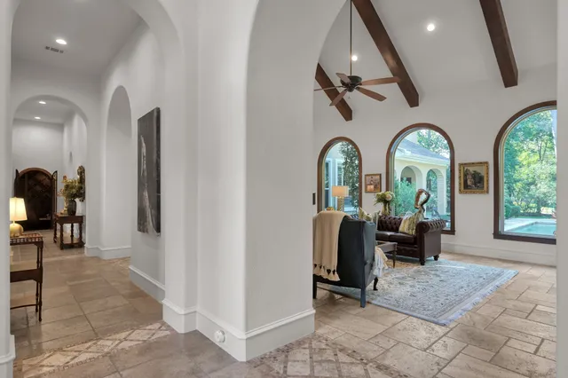 a view of living room with entryway and couches