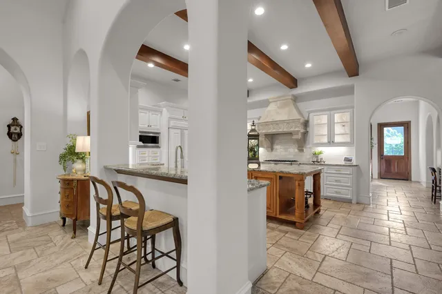 a very nice looking kitchen with a large window cabinets and stainless steel appliances