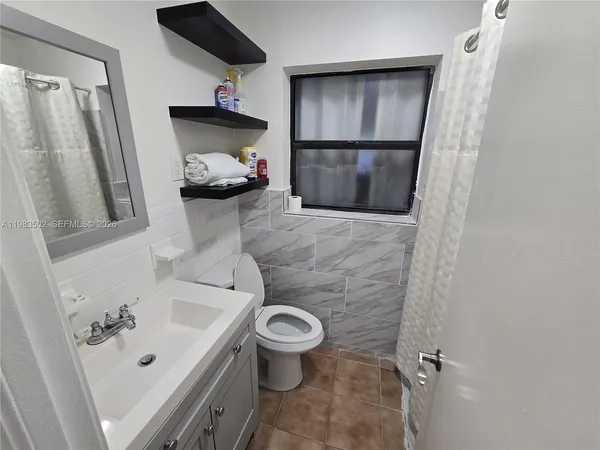 a bathroom with a sink and toilet