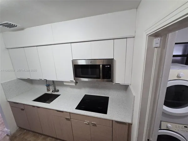 a view of kitchen and sink