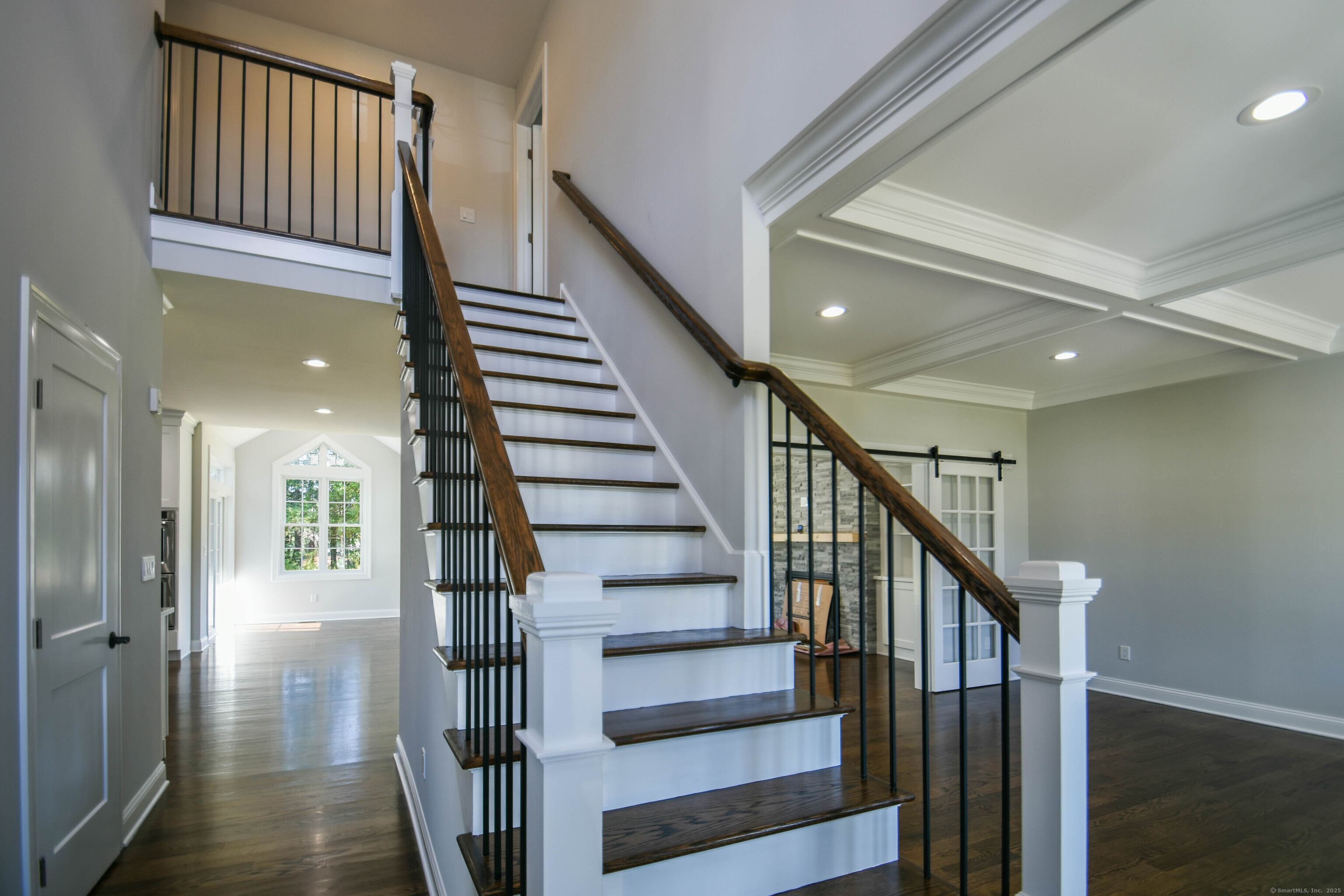 1481 Marion Road Cheshire, CT 06410 - Photo 17 of 30 a view of staircase with lots of frames on wall and wooden floor
