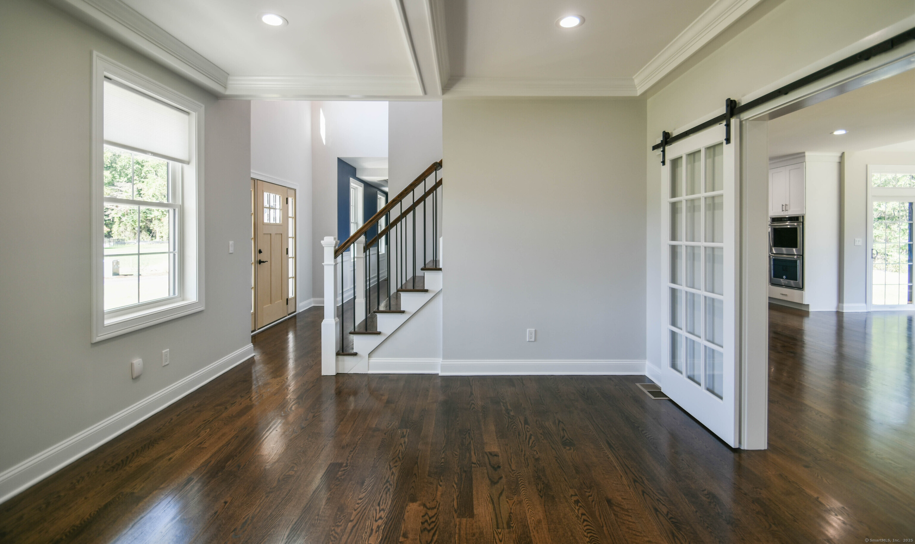 1481 Marion Road Cheshire, CT 06410 - Photo 28 of 30 a view of entryway with wooden floor and staircase