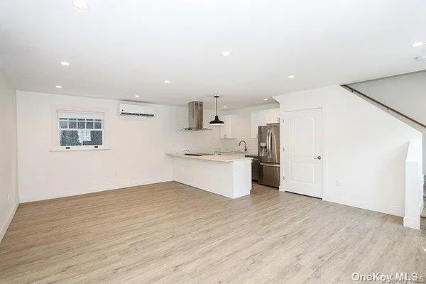 a view of kitchen with wooden floor