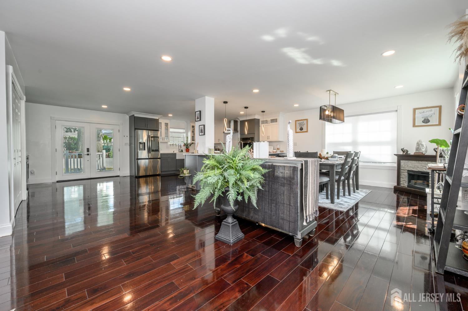 289 Indiana Street Union, NJ 07083 - Photo 12 of 45 a living room with furniture and a dining table with wooden floor