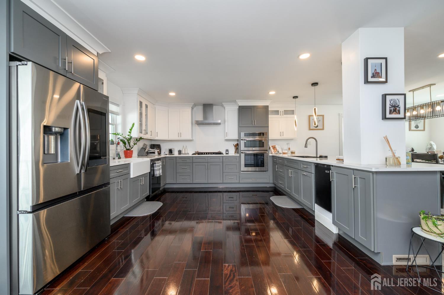 289 Indiana Street Union, NJ 07083 - Photo 15 of 45 a large kitchen with stainless steel appliances a refrigerator a sink a stove and cabinets