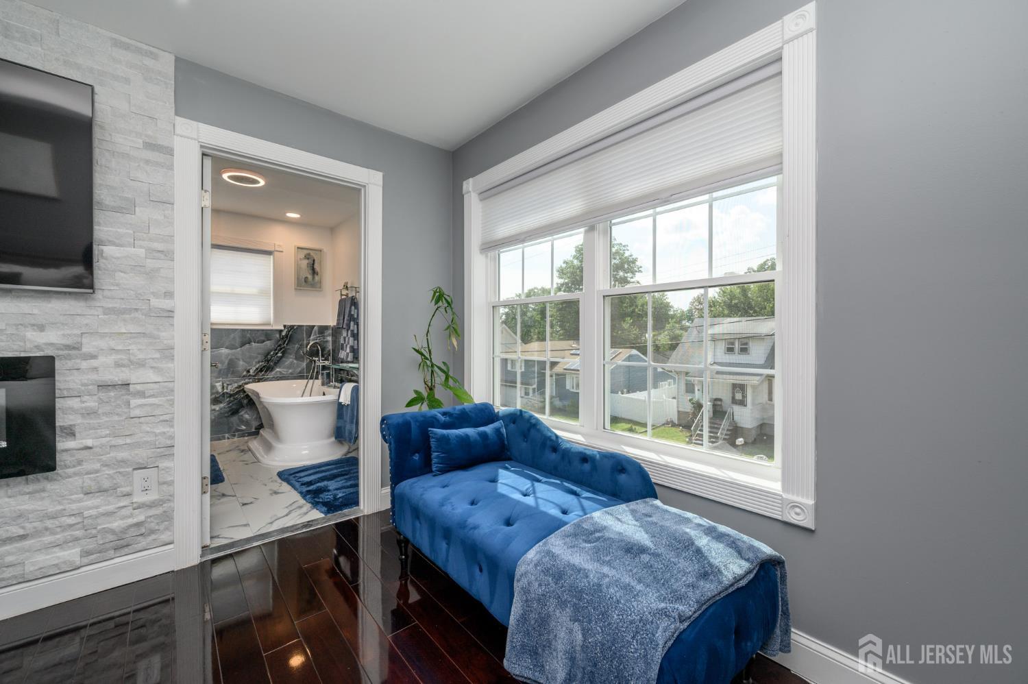 289 Indiana Street Union, NJ 07083 - Photo 22 of 45 a living room with furniture and a flat screen tv