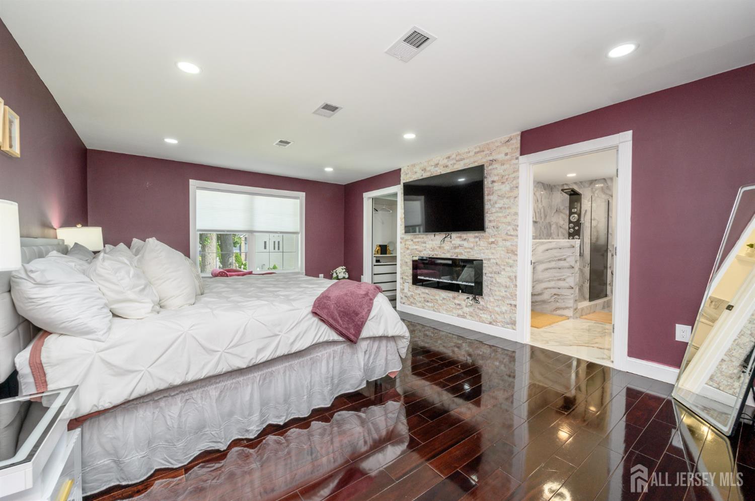 289 Indiana Street Union, NJ 07083 - Photo 29 of 45 a large bedroom with bed tv and window