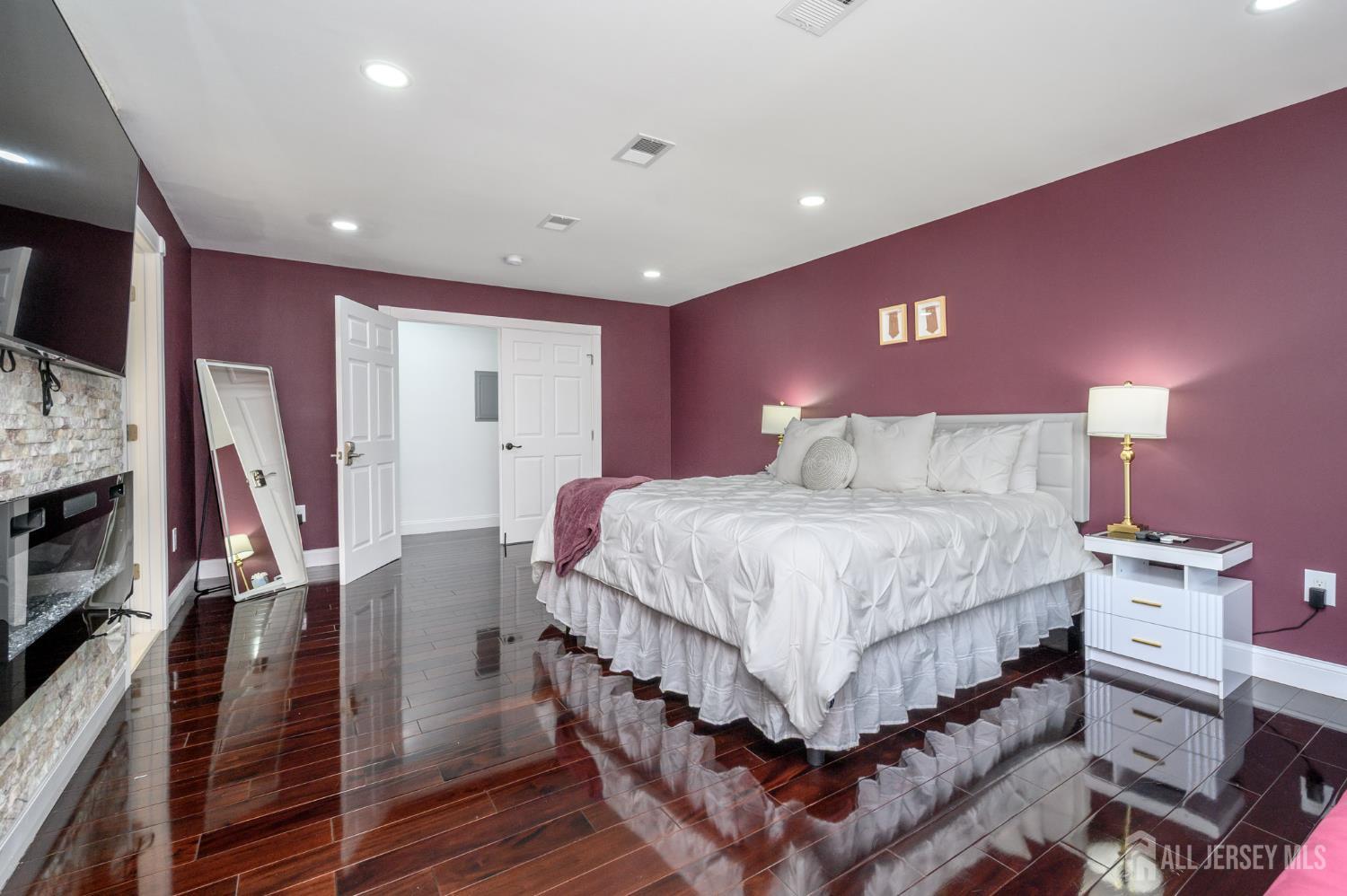 289 Indiana Street Union, NJ 07083 - Photo 30 of 45 a bedroom with a bed and a flat screen tv