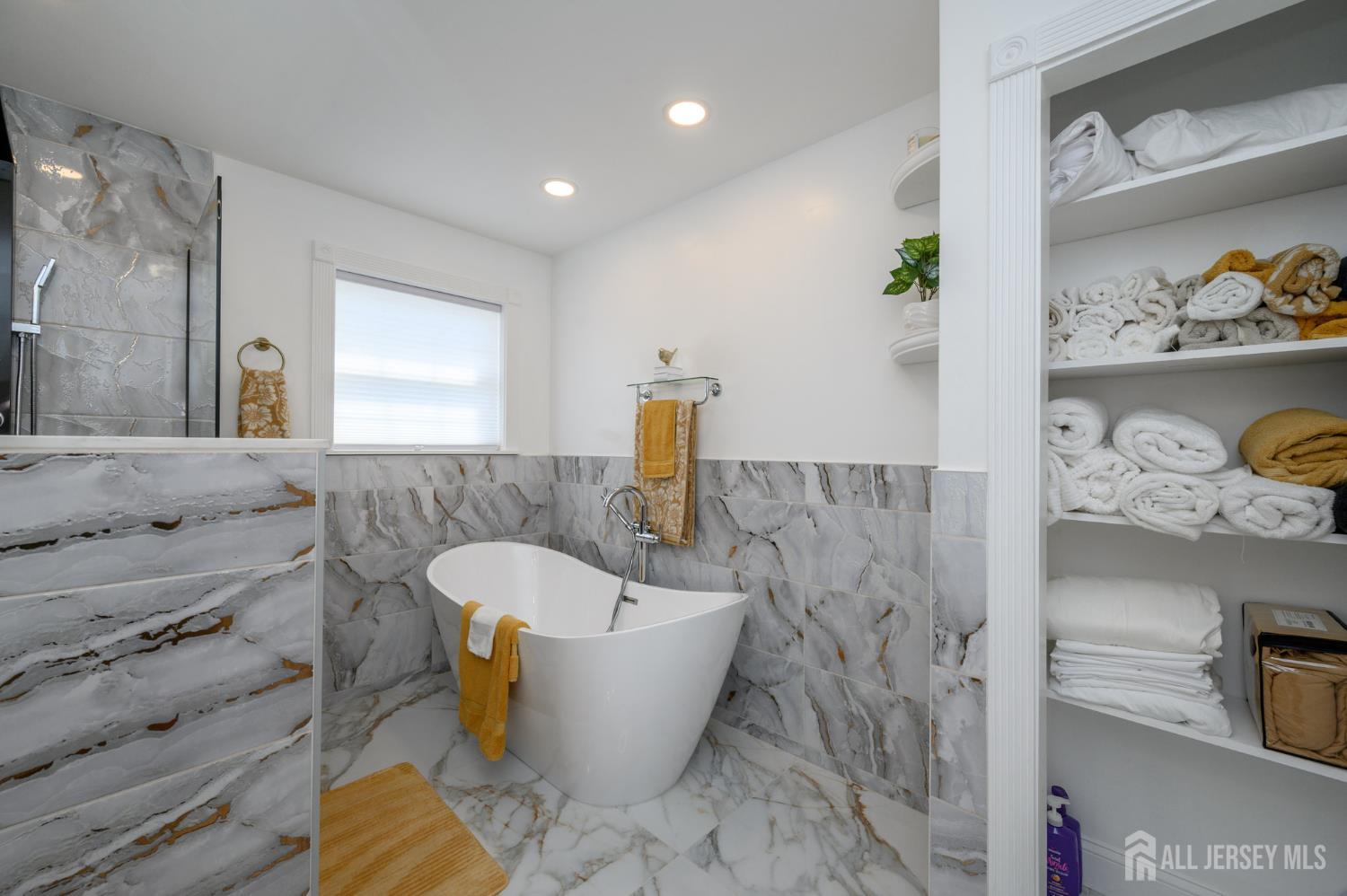 289 Indiana Street Union, NJ 07083 - Photo 33 of 45 a bathroom with a bathtub and sink